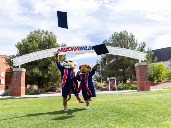 Wilbur and Wilma in graduation caps and gowns