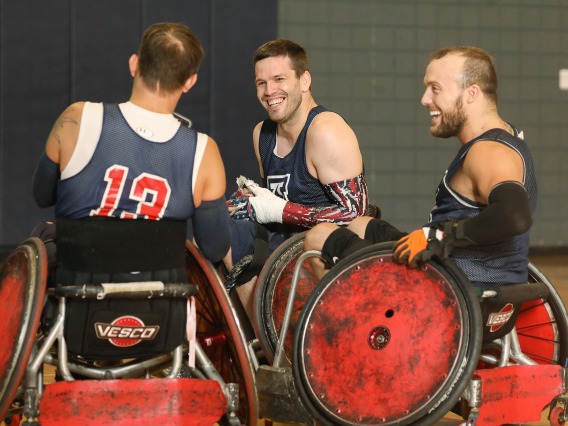 Wheelchair rugby players laughing