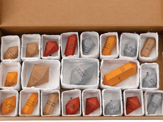 Box containing 21 origami gemstones