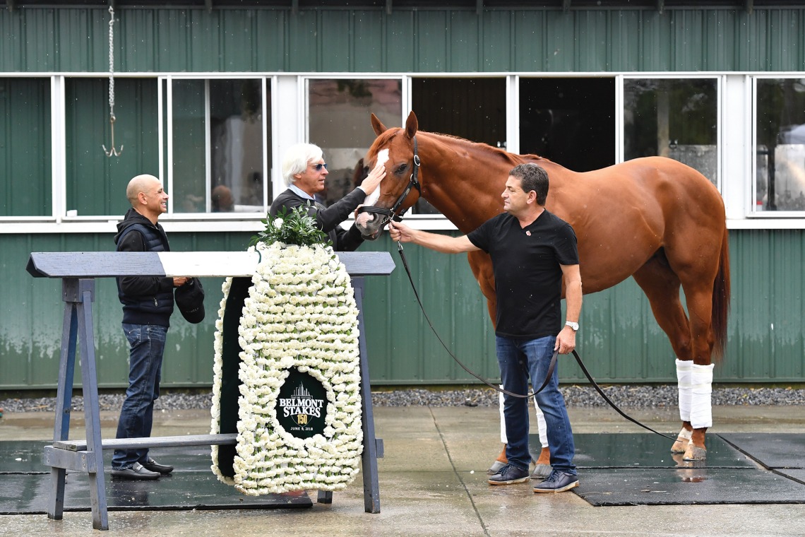 A photograph of Justify, the horse, with trainer Bob Baffert and jockey Mike Smith