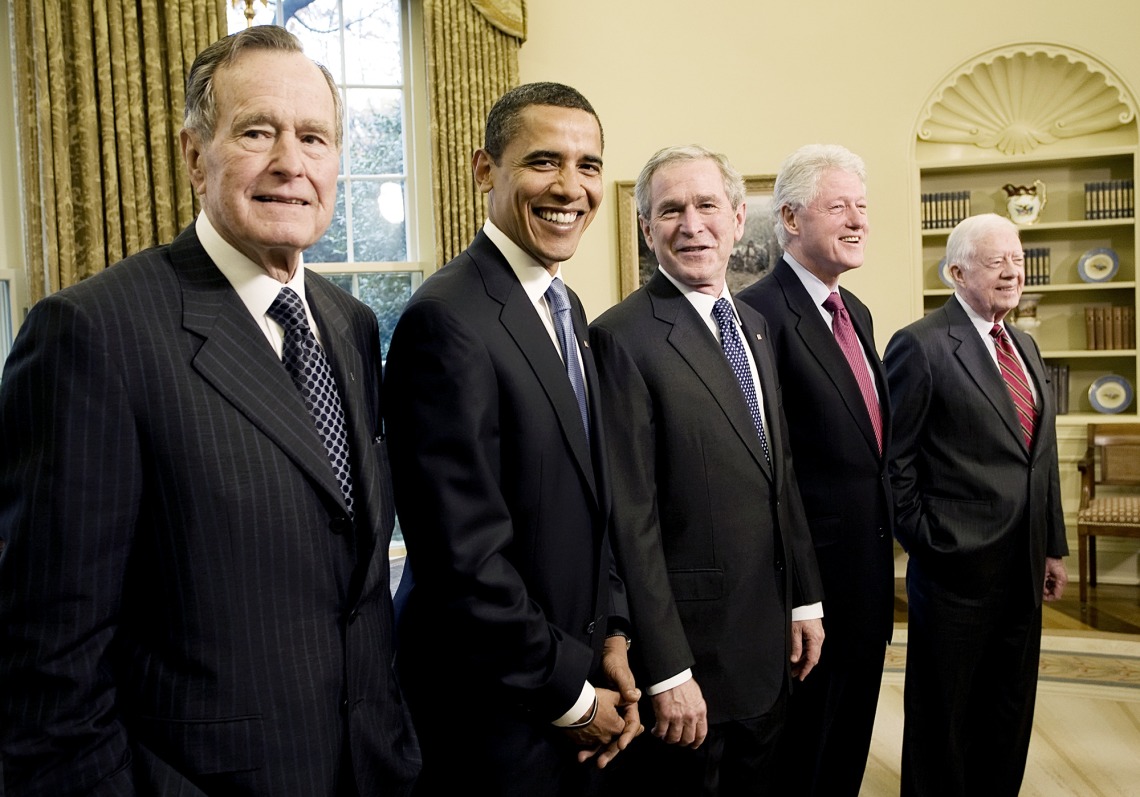 A photograph of George H.W. Bush, George W. Bush, Bill Clinton and Jimmy Carter with then President-elect Barack Obama standing in a line in the Oval office