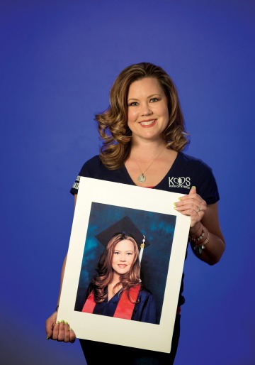 A photograph of Amber Breton holding a photograph of her graduation