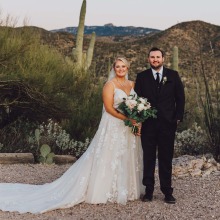 Bride and groom in desert background